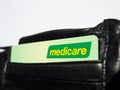 Medicare card is a publicly funded universal health care system in Australia, the image shows the card in a black wallet.
